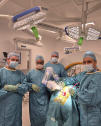 Mr. Bhaskar Thakur and his surgical team performing robotic spine surgery. Robotic spine surgery team performing a spinal procedure